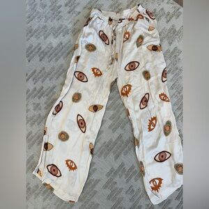 Women's White and Orange Eye Patterned Casual Pants